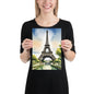 Person holding an A4 size poster print of the Eiffel Tower against a white background by Impressions Art.